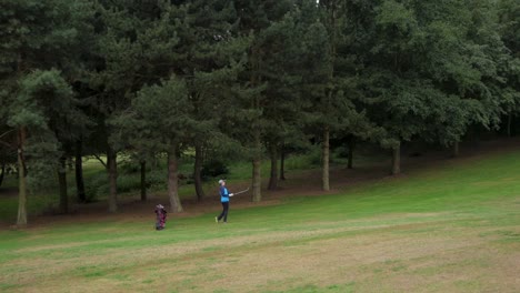 tight shot of a player hitting a fairway shot