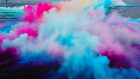 colorful smoke clouds over water