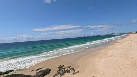 waves crashing on sandy currumbin beach