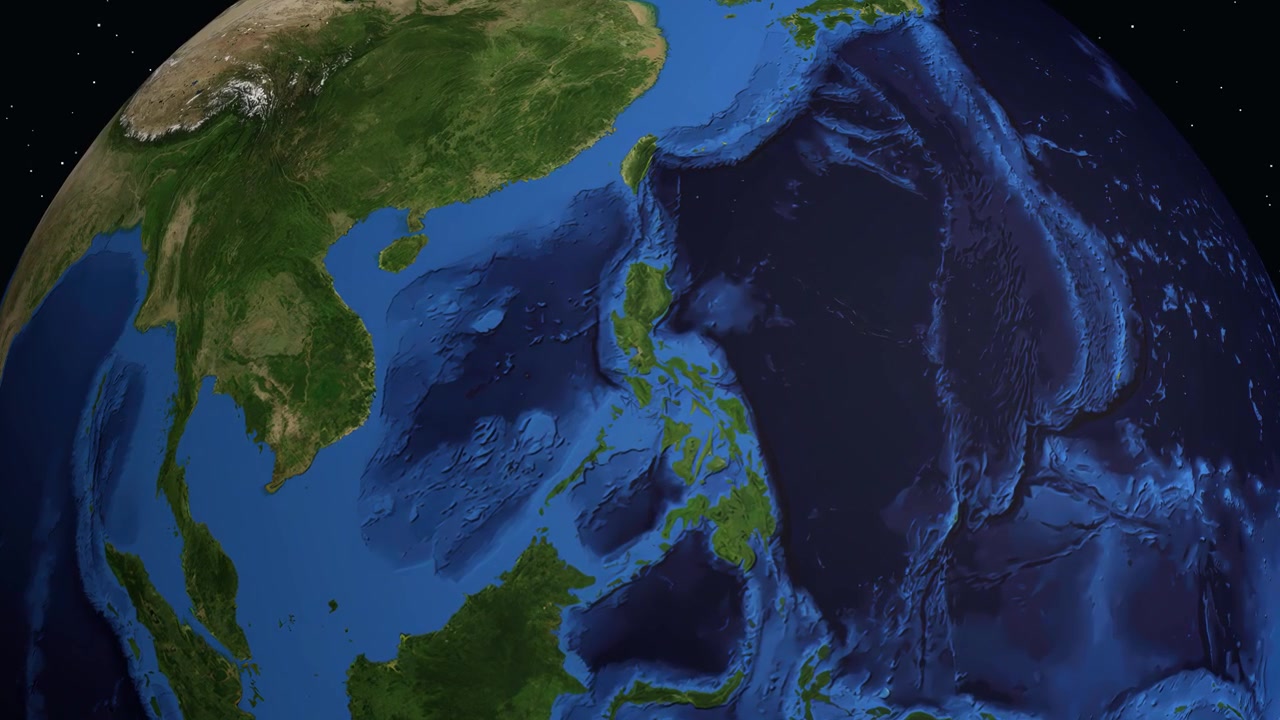 A digital globe rotates and zooms into Calamba, Philippines, displaying geographic and demographic information