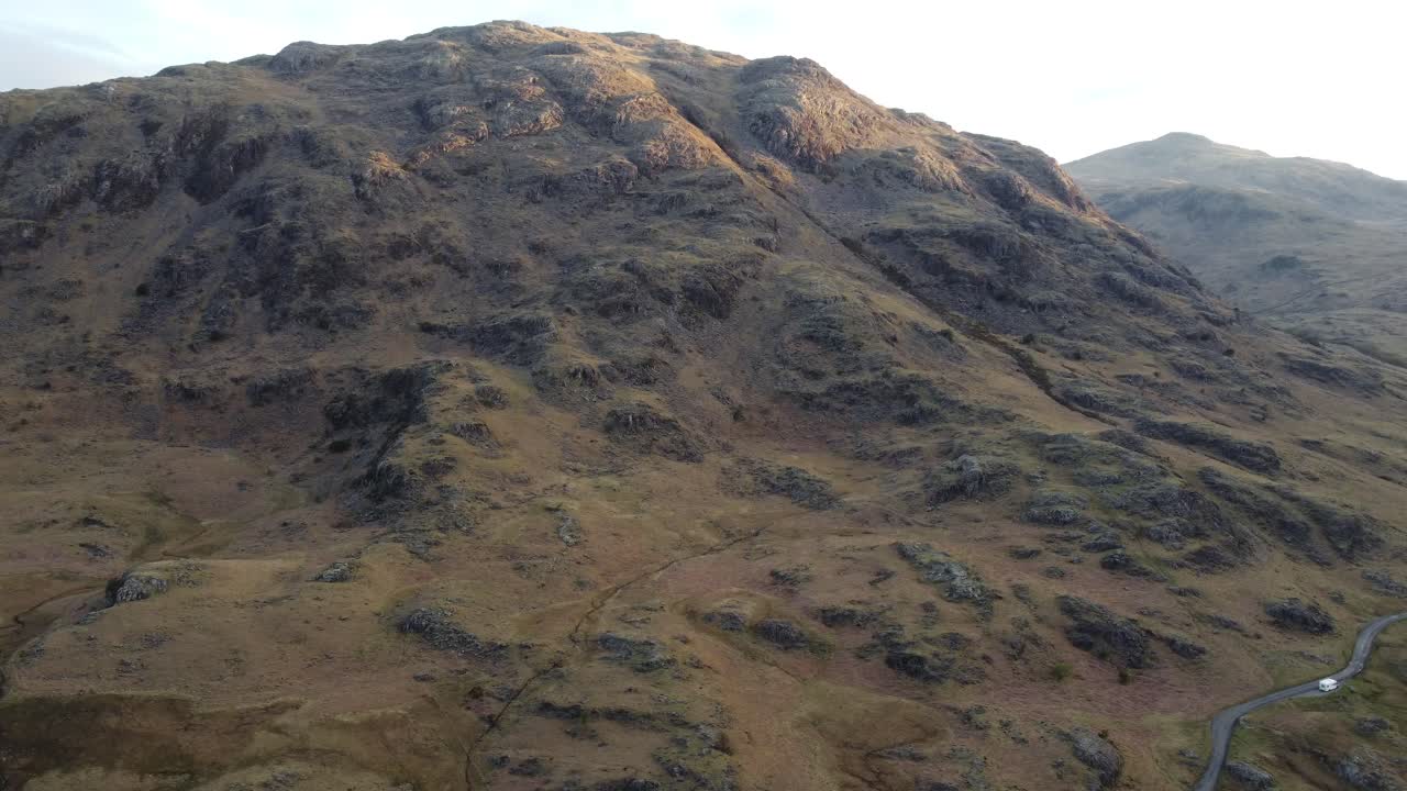 Rugged mountains as the sun beams down during sunrise