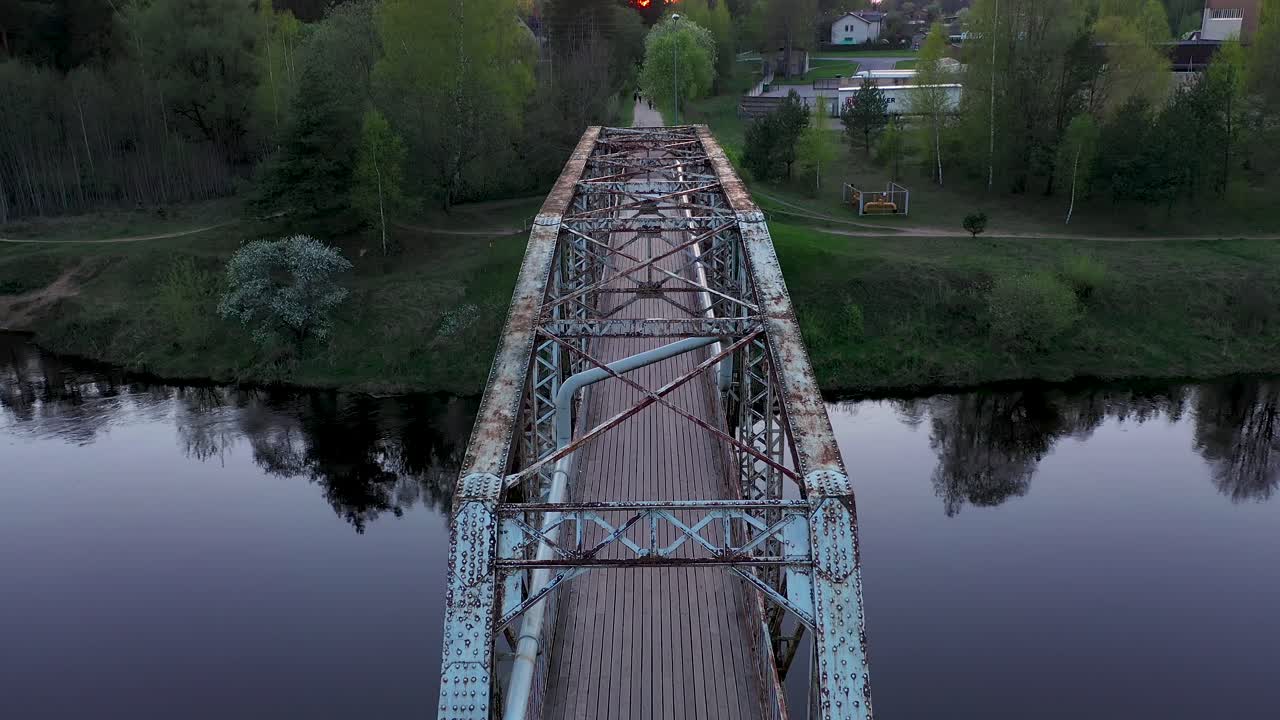 Cinematic drone view of old pedestrian bridge in Valmiera, Latvia