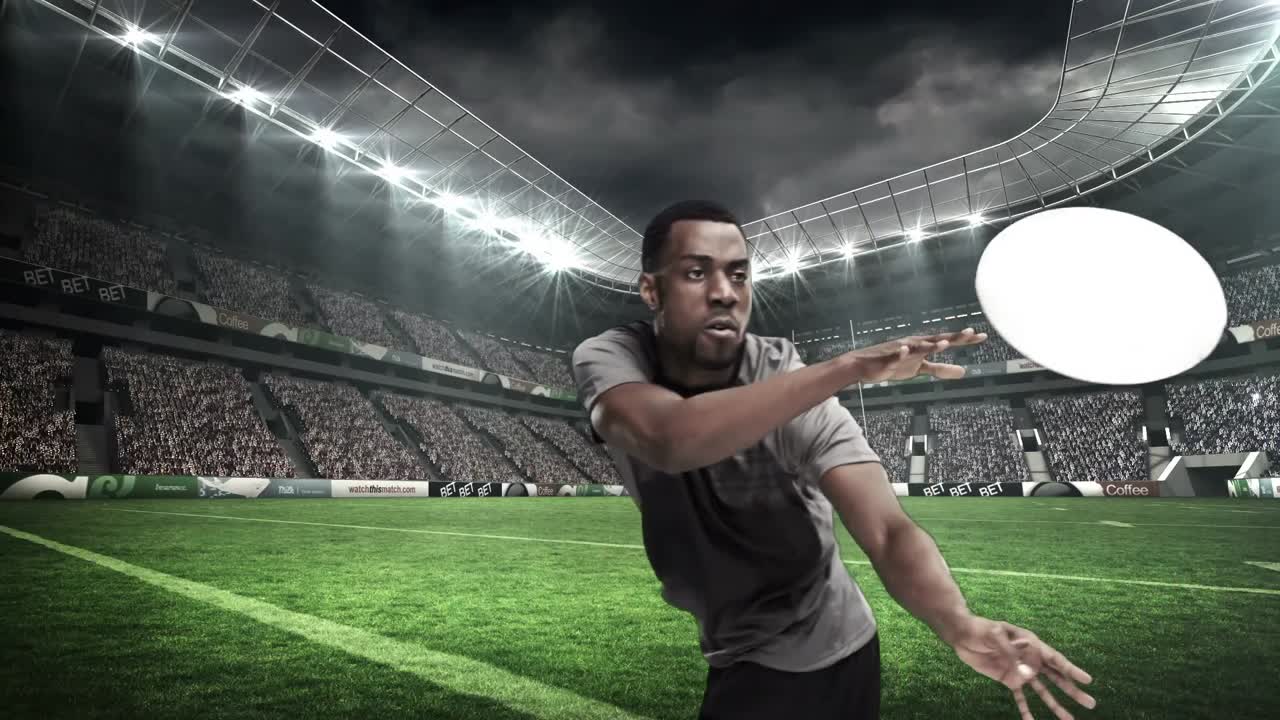 심각한 럭비 선수가 공을 던지고 있습니다.