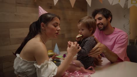 family celebrating a baby's birthday