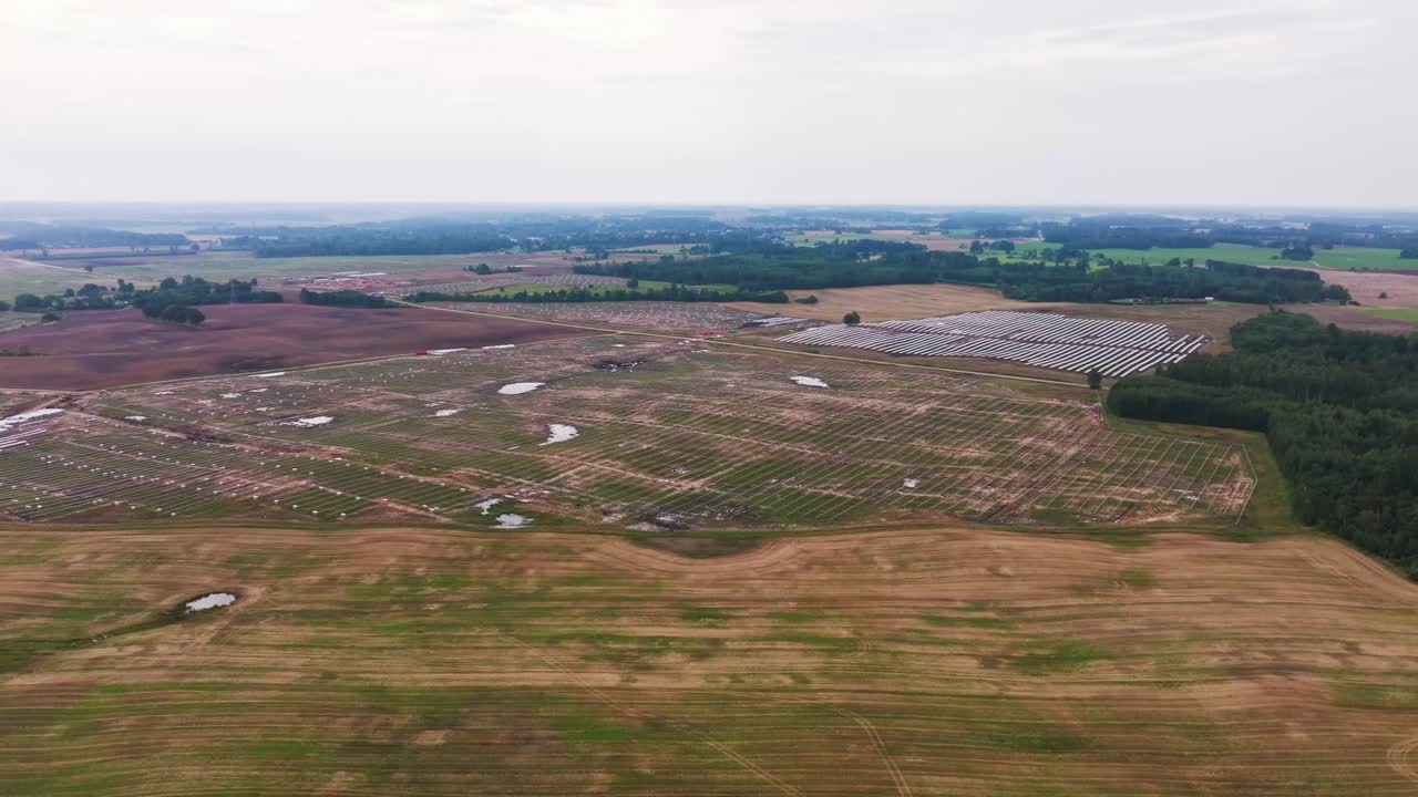 Aerial panorama of solar panel works symbolizing independence from fossil fuels