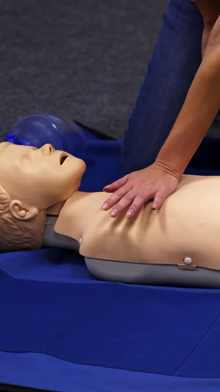 Infant CPR manikin first aid. Cardiopulmonary resuscitation and first aid for child. Vertical video