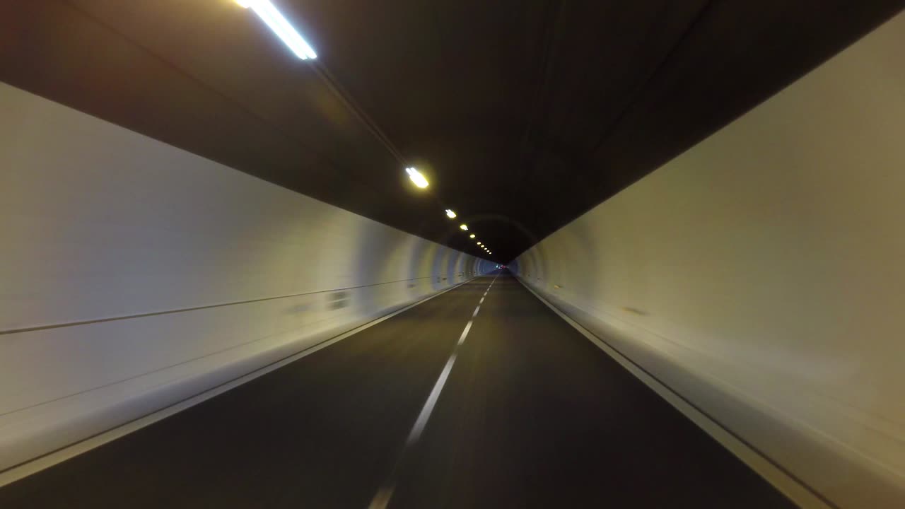 Car rides through the tunnel point-of-view driving Seamless loop time lapse video