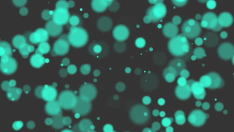 Green-glitters-and-particles-on-black-background