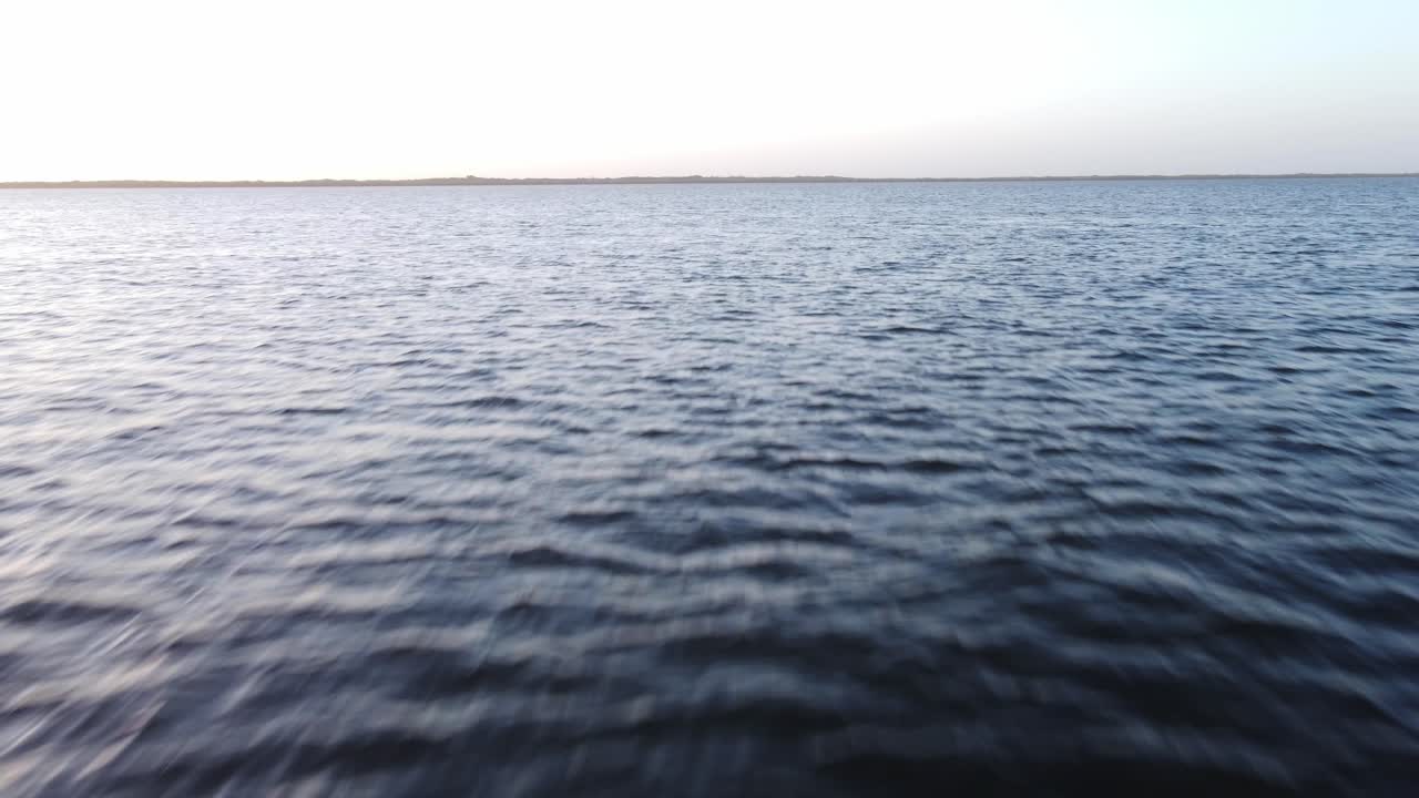 Fast Drone Shot Along the Water of a Blue River