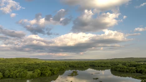 clouds sprawl towards lake sequoyah waterways and wetlands, near fayetteville ar, usa - hyperlapse aerial