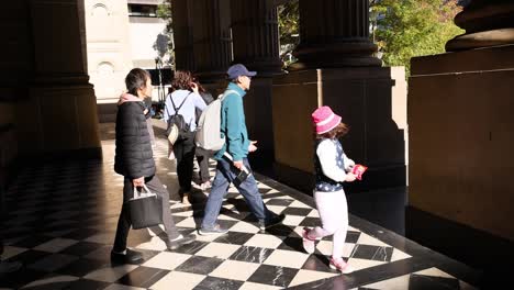 pedestrians walking near state library victoria