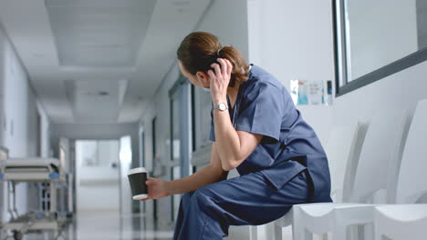 exhausted nurse in a hospital corridor, with copy space