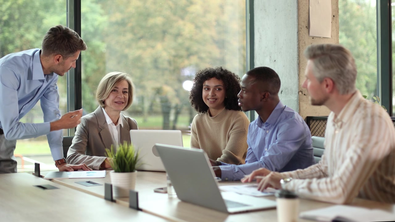 Manager Leading a Discussion with Diverse Business Team in Office