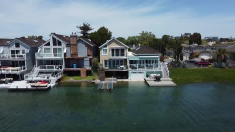 slider close shot of riverside villas and residential properties alongside at san mateo aquatic park