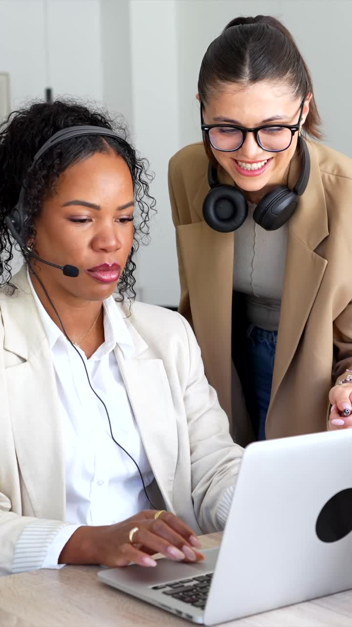 Two Businesswomen Collaborating on a Laptop