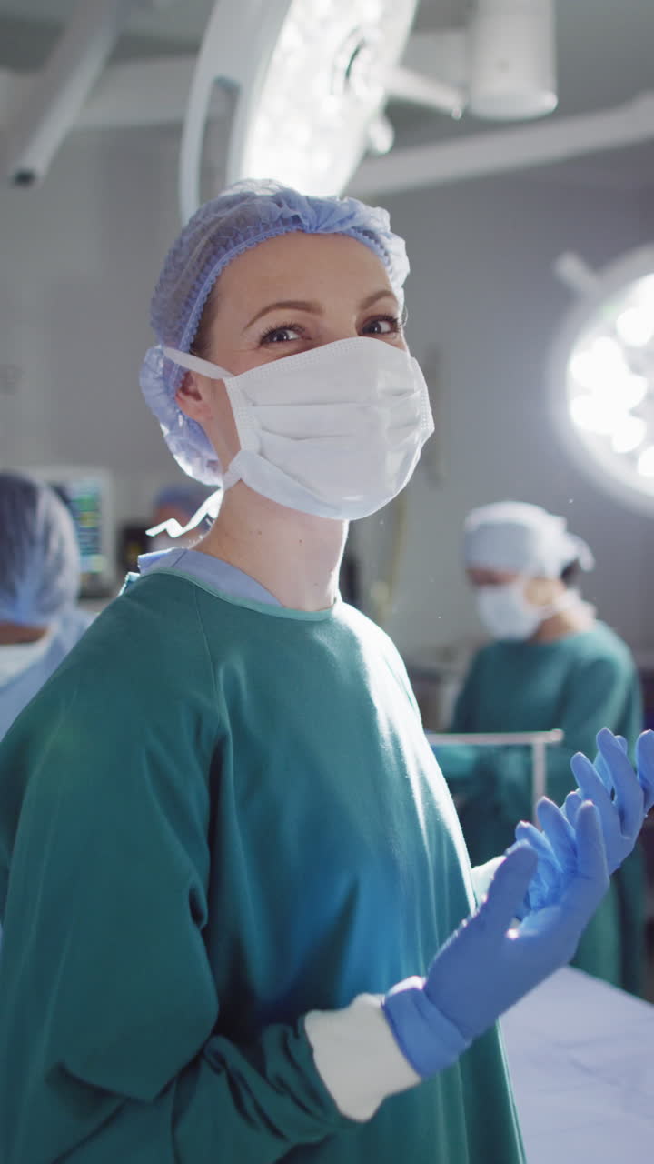 Vertical video of portrait of diverse surgeons with face masks