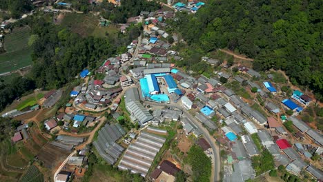 Stunning-slow-motion-cinematic-drone-reveal-over-rural-mountain-village-in-Thailand