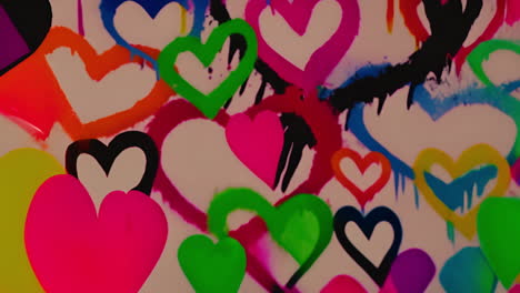 colorful hearts and paint splashes animation on white background