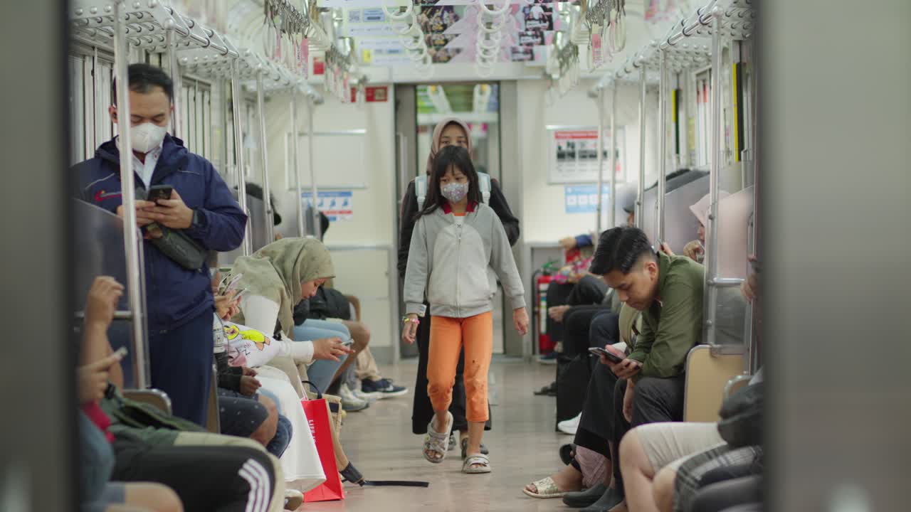 People Wearing Masks on a Train