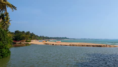 scenic coastal landscape view of beach with fishing boats at tangalle, southern province, sri lanka