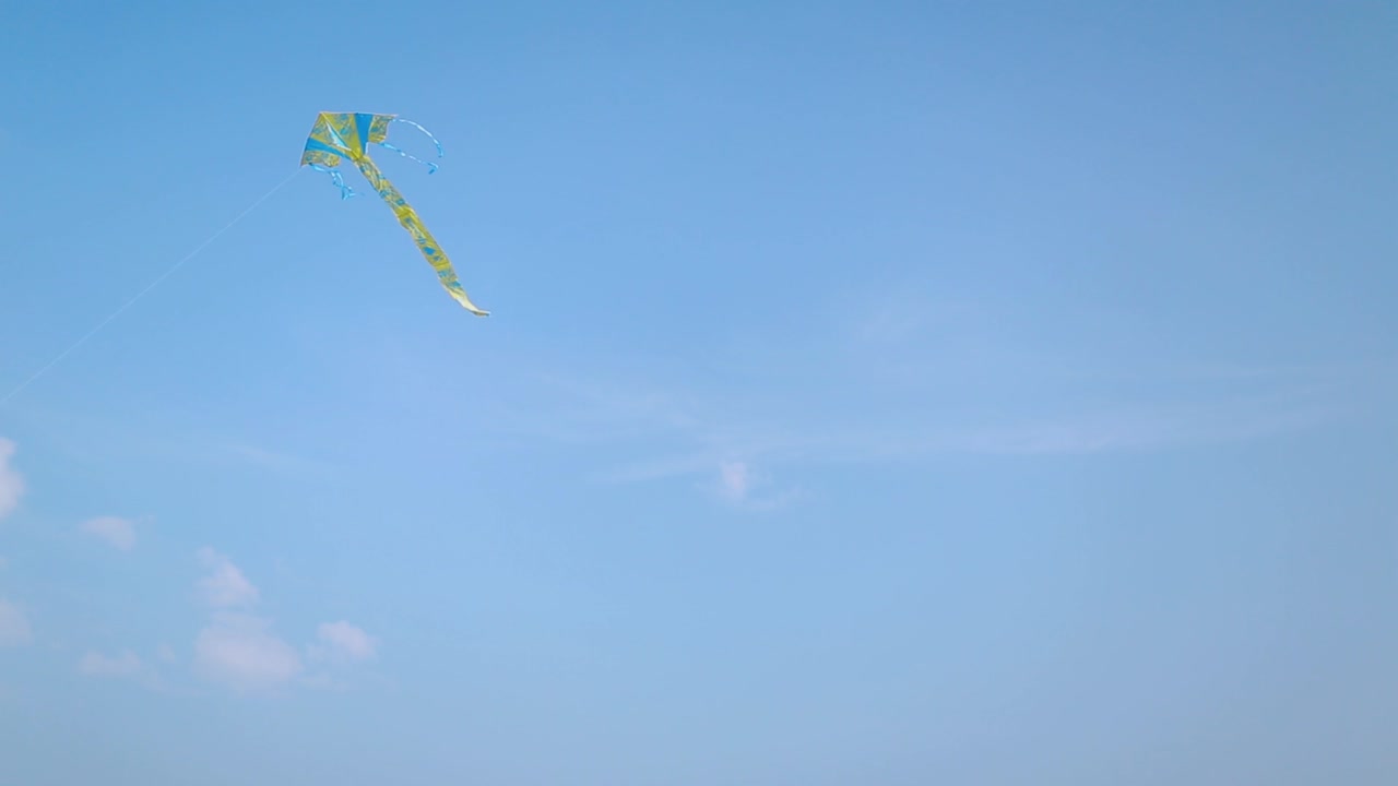 Happy Young Couple In Love Flying A Kite. Young couple in love running with a kite in a yellow field