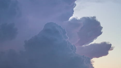 Timelapse-of-an-impressive-and-dramatic-bright-thunderstorm-charged-with-electricity-with-lightning-in-the-sky-and-dark-passing-clouds-on-a-stormy-evening