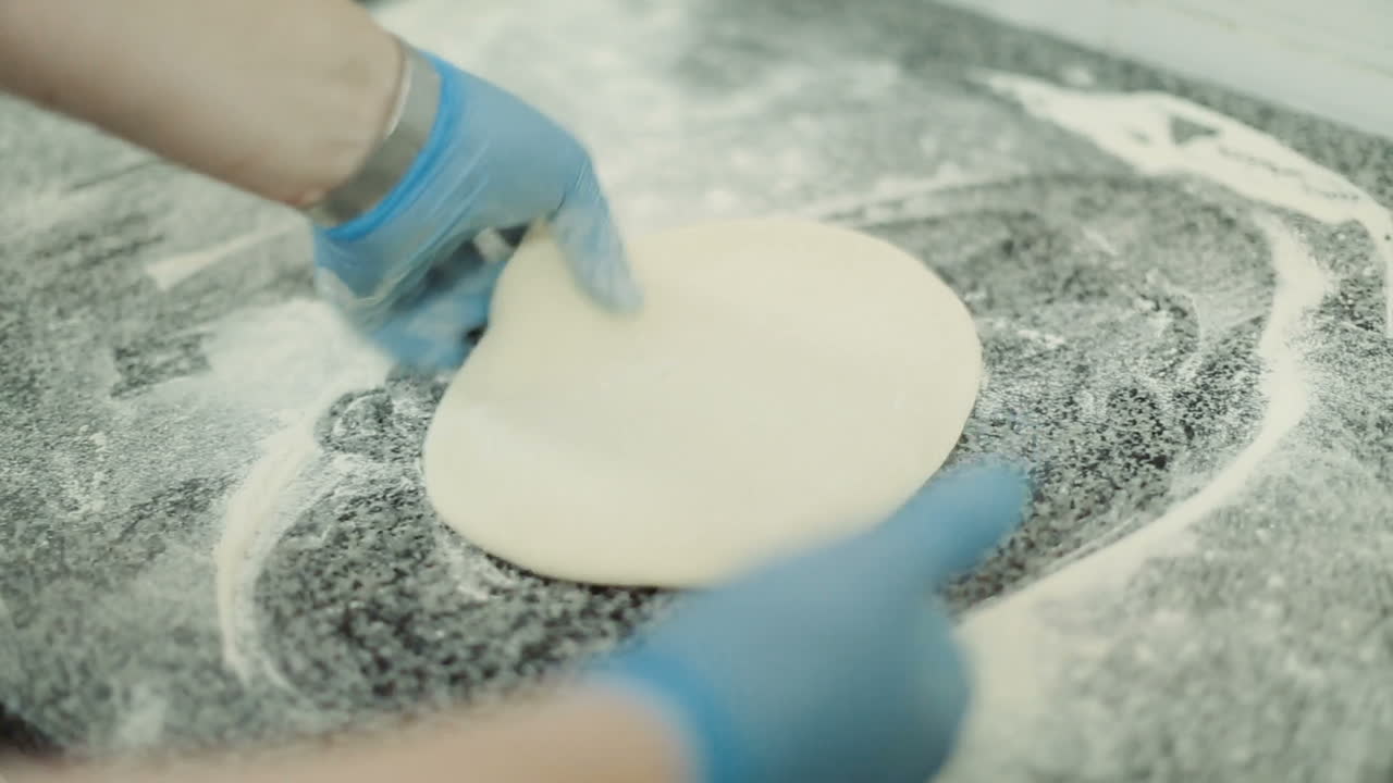 Chef Baker Cook Pizza. Closeup hand of chef baker making pizza at kitchen