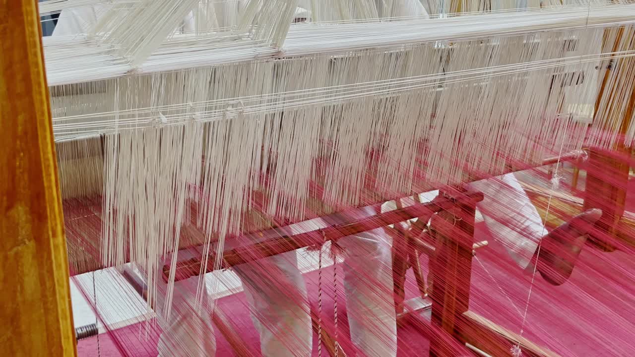 Handloom cloth is crafted by interlacing warp and threads on a manual loom. Skilled artisans dye, spin, and weave fibers like cotton or silk, creating fabrics India