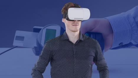 Animation-of-businessman-wearing-vr-headset-touching-virtual-screen-over-payment-terminal