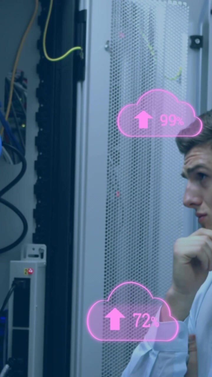 Animation of clouds with uploading over caucasian man checking servers