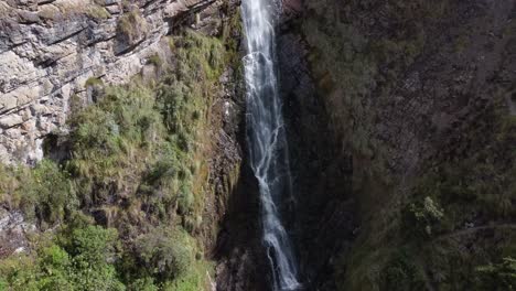 Experience-the-beauty-of-Candela-Fasso-waterfall-with-a-captivating-circular-drone-motion