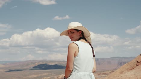 enjoy the stunning view of arches national park in utah through the eyes of a young woman as she stands in awe, gazing out over the breathtaking valley.

shot in 4k with sony a7s iii and dji rs2.