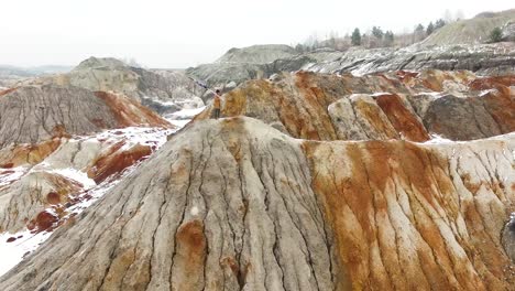 colorful winter quarry landscape with person