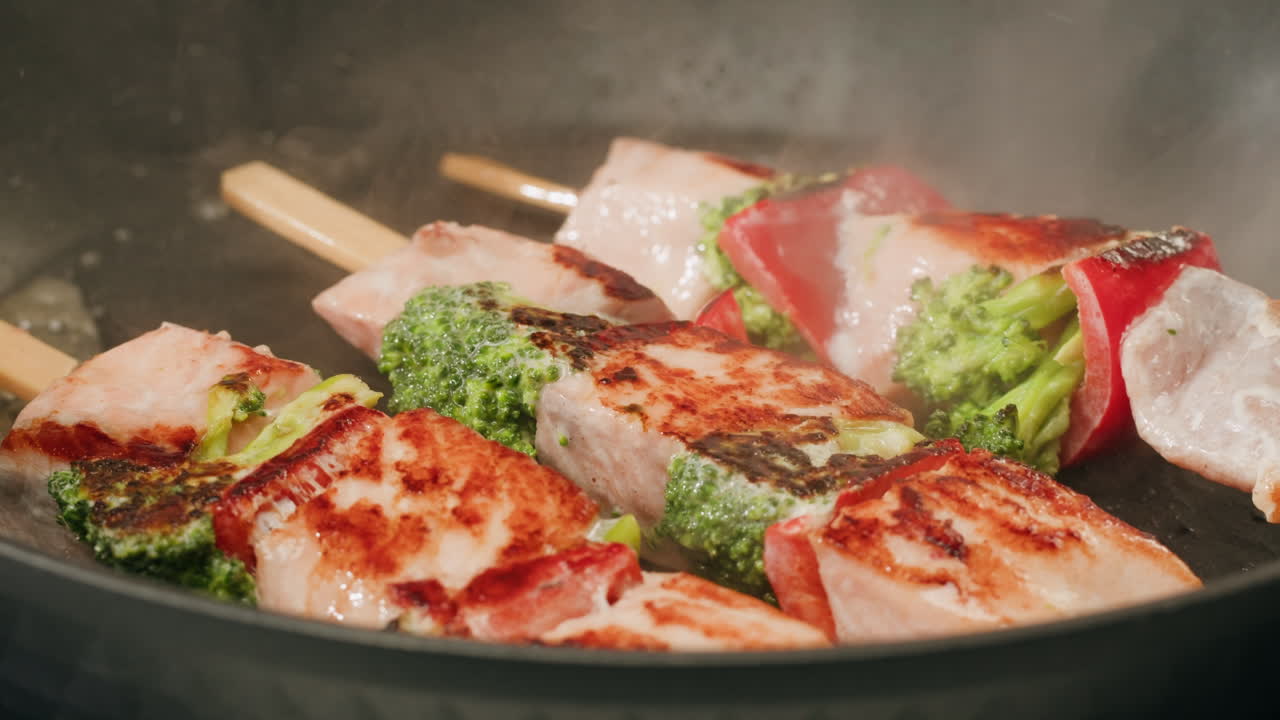 Cooking Salmon Skewers with Broccoli and Vegetables