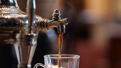 absinthe being poured into a glass