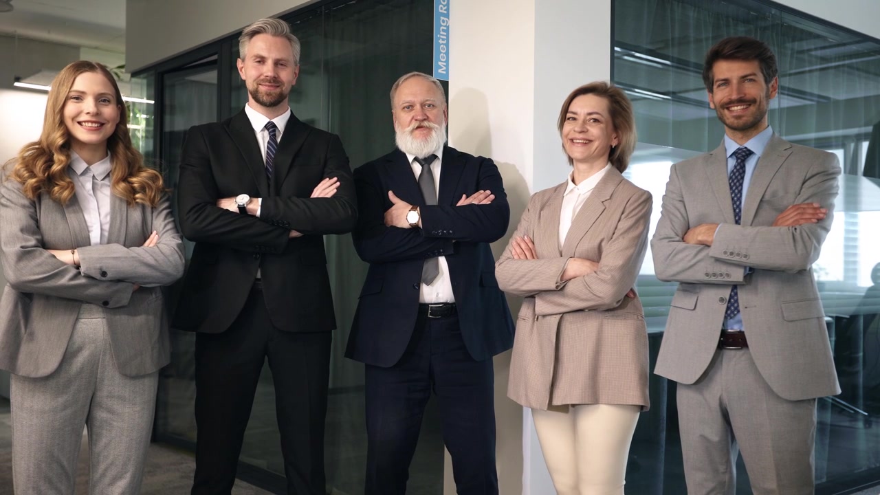 Confident Business Team Standing and Smiling in Modern Office