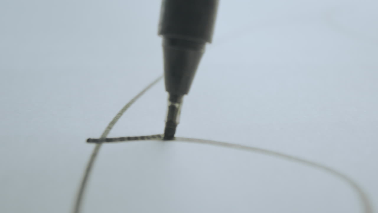 Close-up of a pen drawing on paper