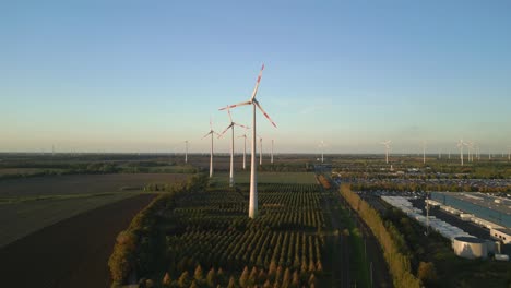 amazing aerial view flight panorama overview drone
of a wind farm wheel field at brandenburg germany at summer day evening 2022