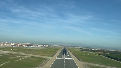 An-airport-runway-as-seen-by-the-pilots-from-the-cockpit-in-a-real-flight-in-a-bright-winter-morning