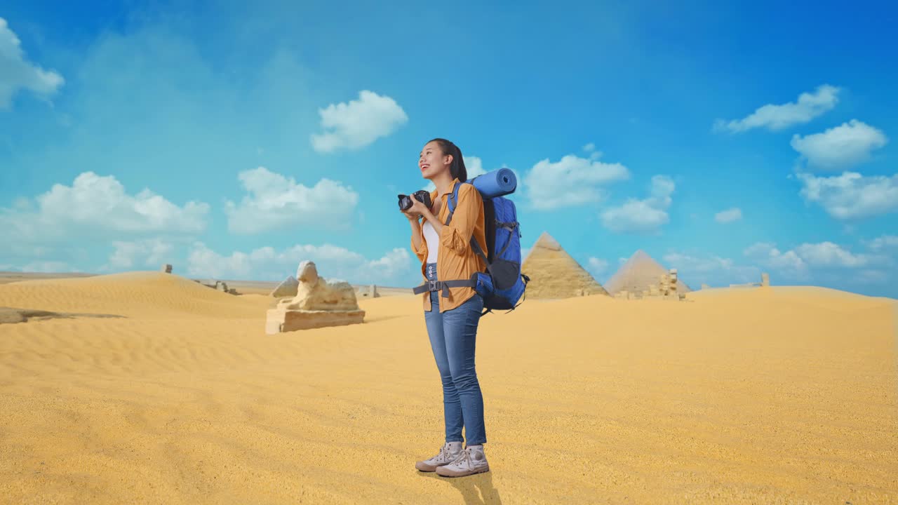 Woman Traveler Photographing Pyramids in the Desert