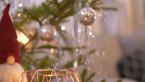 panning of santa gnome and christmas tree ornaments, rack focus