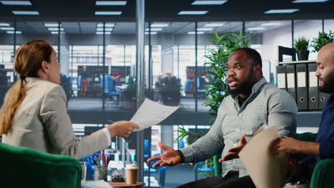 vertical video multiethnic professionals in a heated argument during corporate negotiation