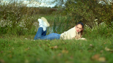 teenage girl relaxing in a meadow