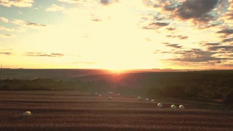 heavenly golden sunset over a beautiful farm field landscape