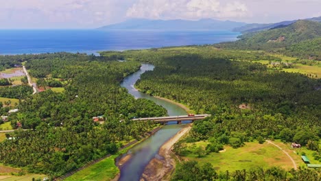 bridge over river on dense forest trees near saint bernard village in southern leyte, philippines