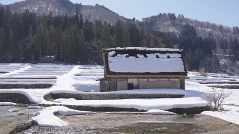 snow on the roof of shirakawago village home in japanese alps