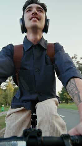 man riding a bike in a park