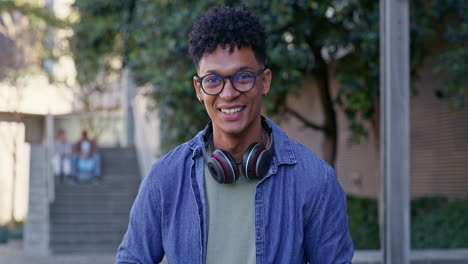 man working on laptop on college campus