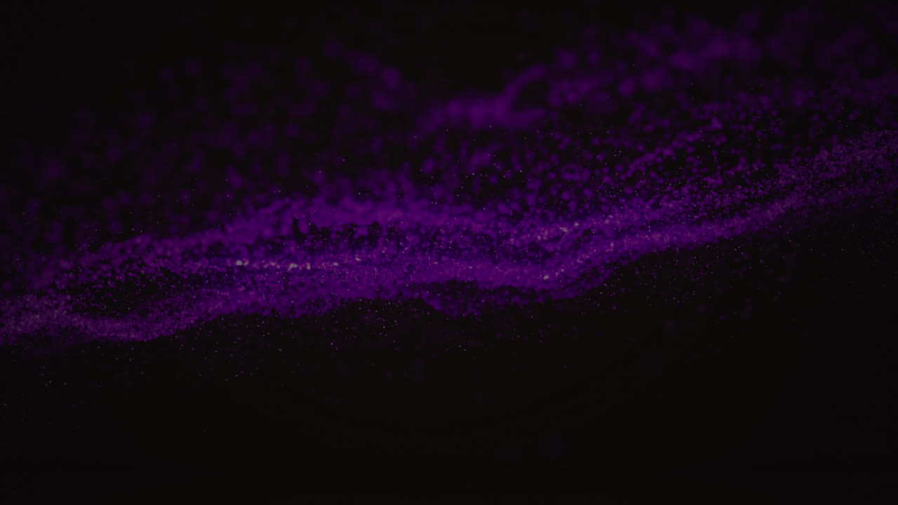 Animation of purple wave of spots on black background