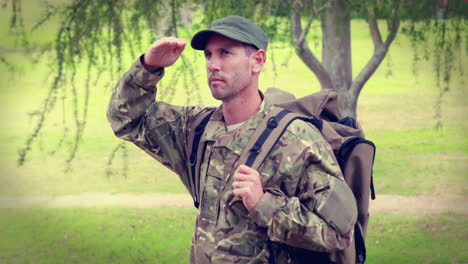 serious soldier looking away with hand on forehead